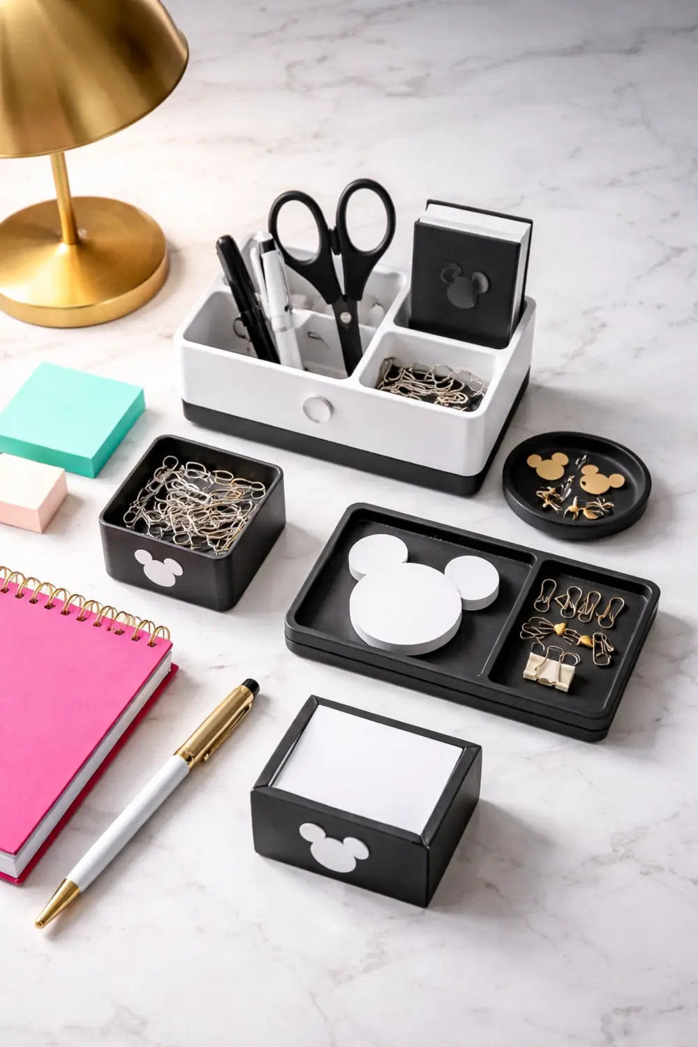 Flat-lay of black and white Mickey Mouse desk organizers with colorful office supplies, perfect for Disney fans