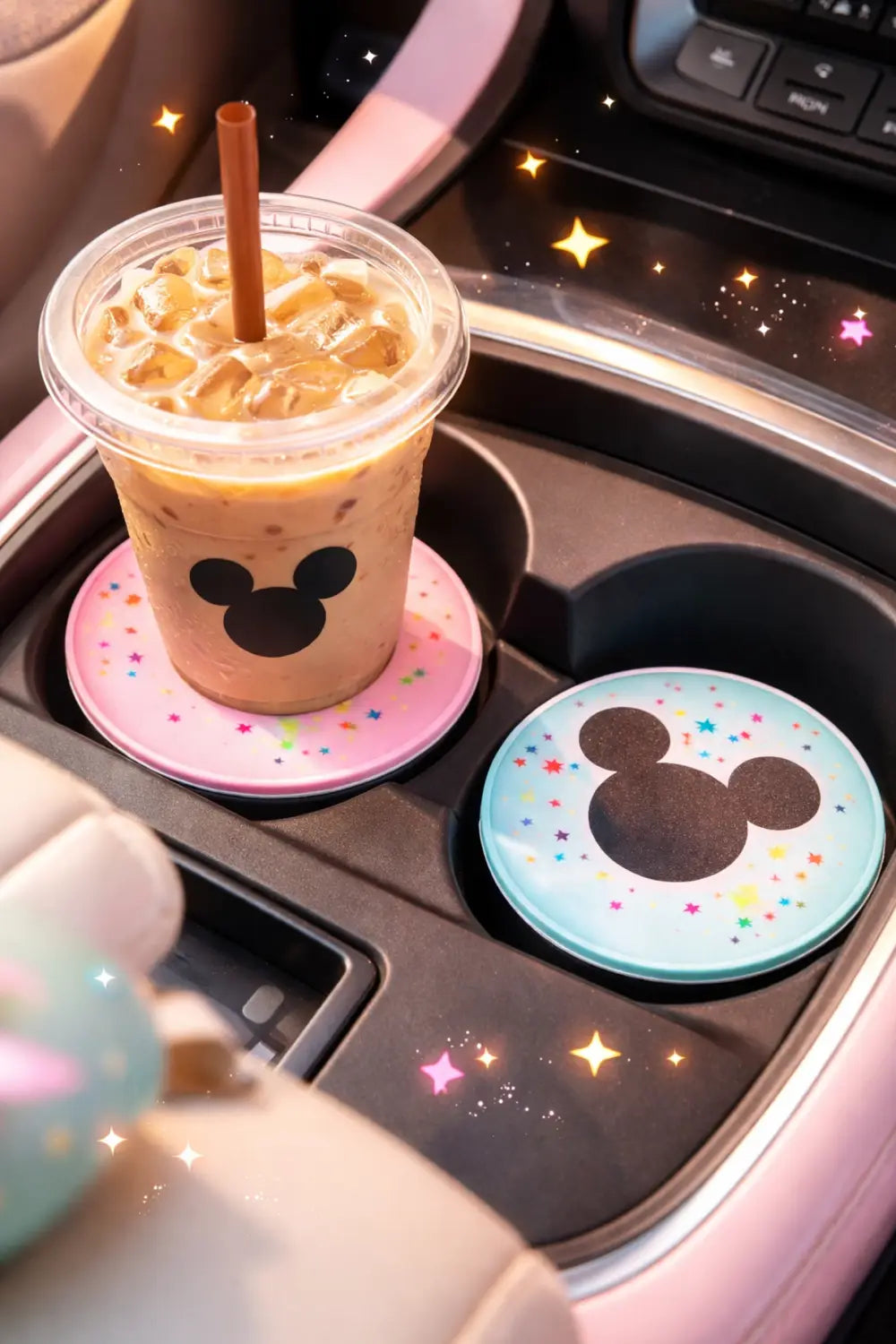 Colorful Disney car cup holders with Mickey Mouse coasters and iced coffee adding joyful Disney detail